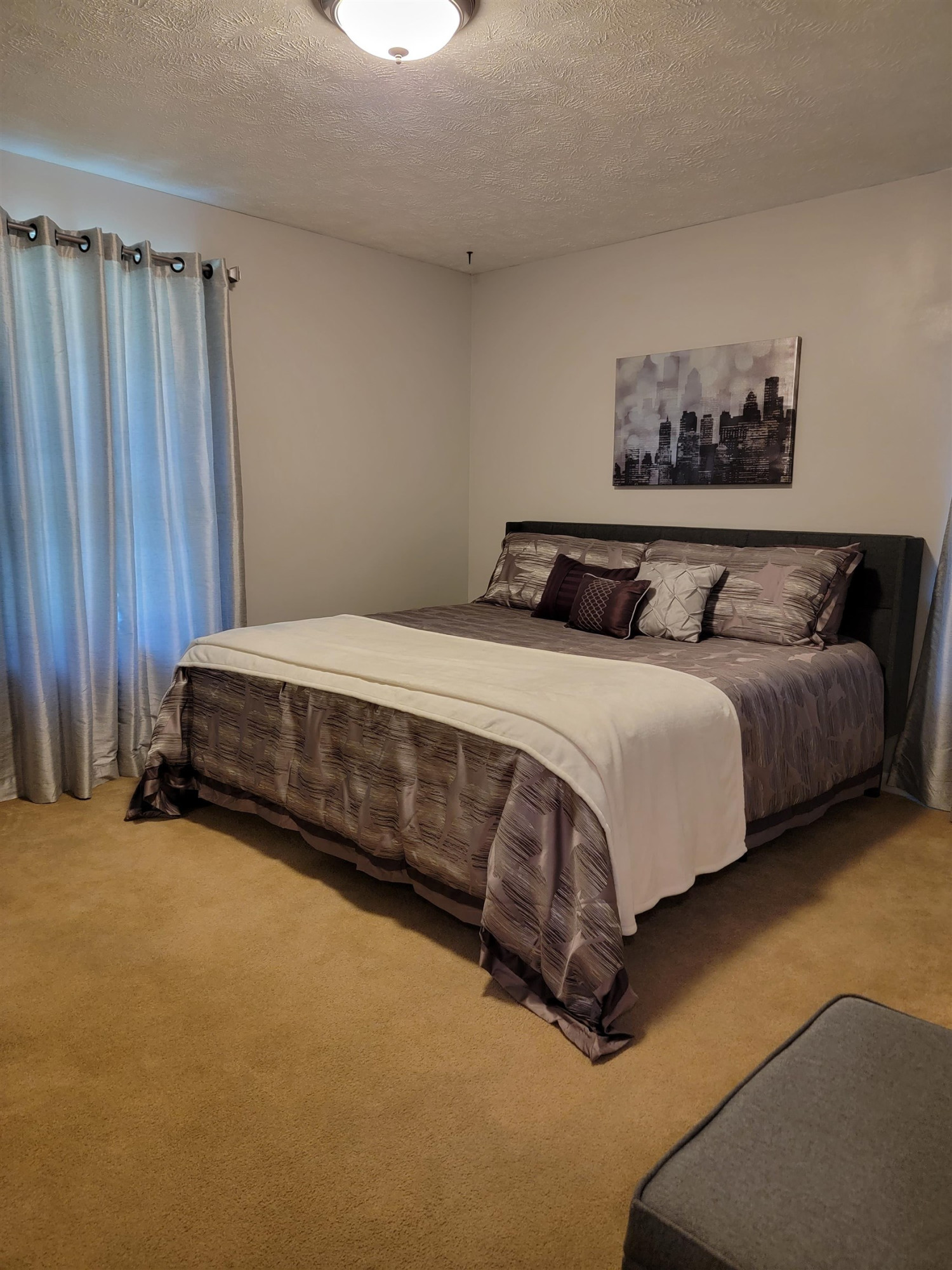 48 Windy Hill Road Jackson, TN 38305 - Photo 14 of 20 a bedroom with a bed and a furniture