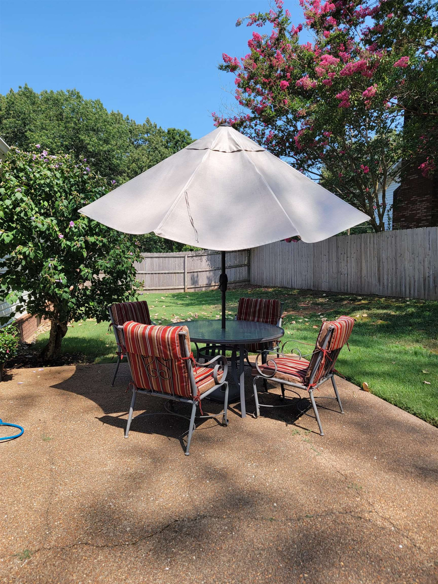 48 Windy Hill Road Jackson, TN 38305 - Photo 16 of 20 a view of patio with chairs and table under an umbrella
