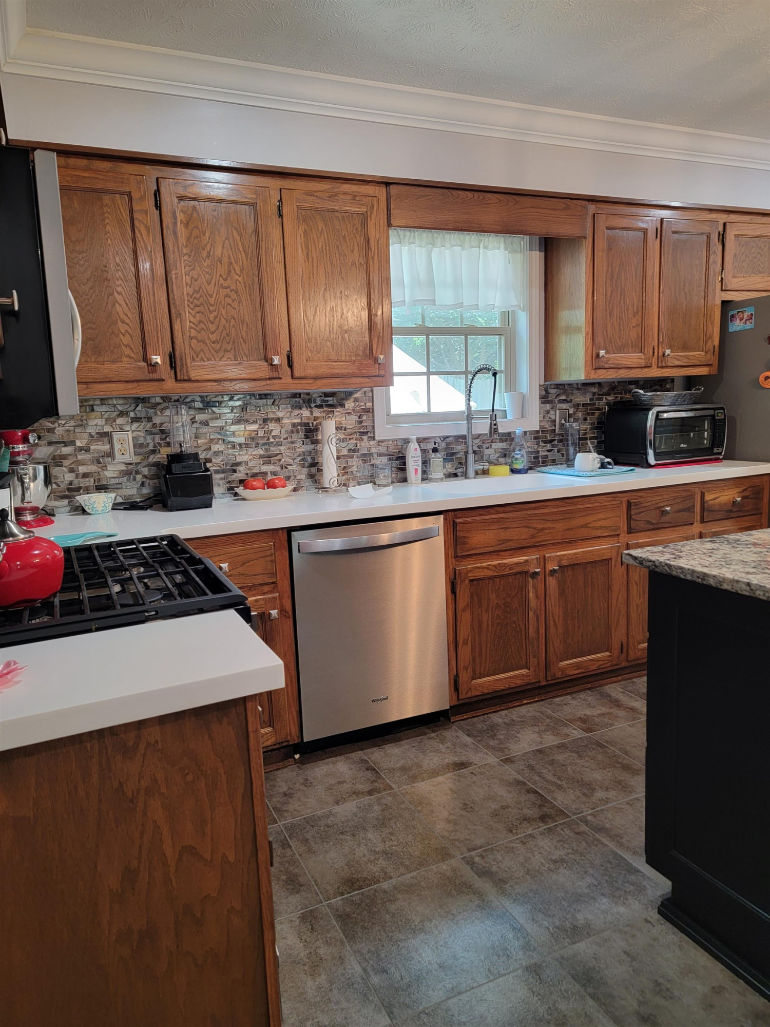48 Windy Hill Road Jackson, TN 38305 - Photo 2 of 20 a kitchen with sink a stove and cabinets