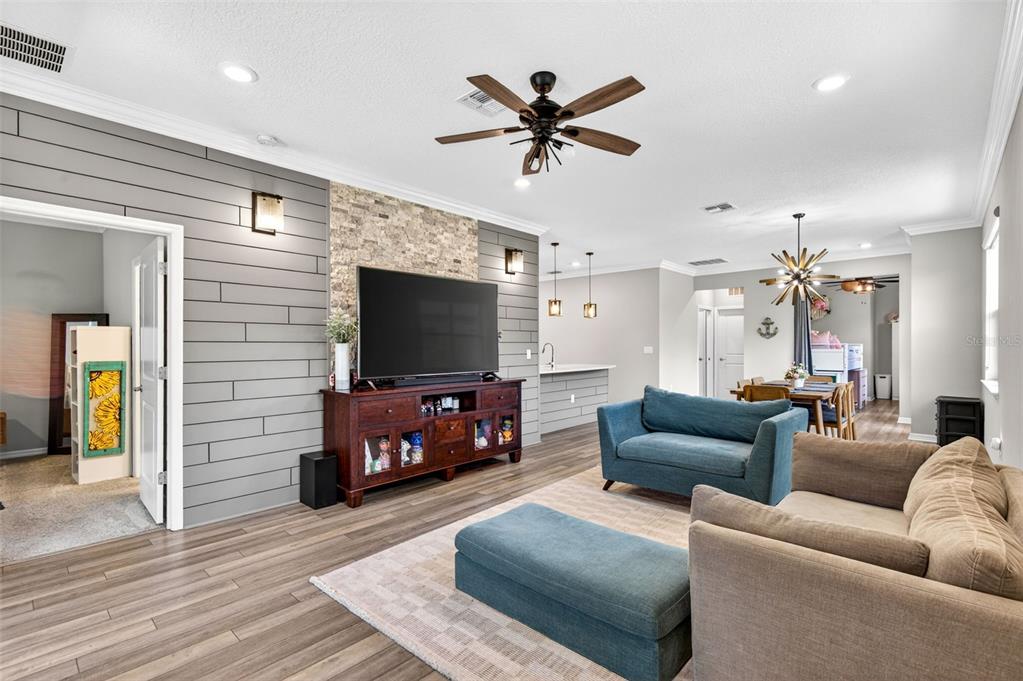 6427 Mooring Line Circle Apollo Beach, FL 33572 - Photo 18 of 34 a living room with furniture and a flat screen tv