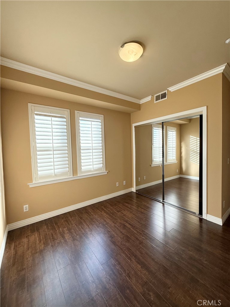 57 Alice Street, Unit A Arcadia, CA 91006 - Photo 11 of 34 a view of an empty room with wooden floor and a window