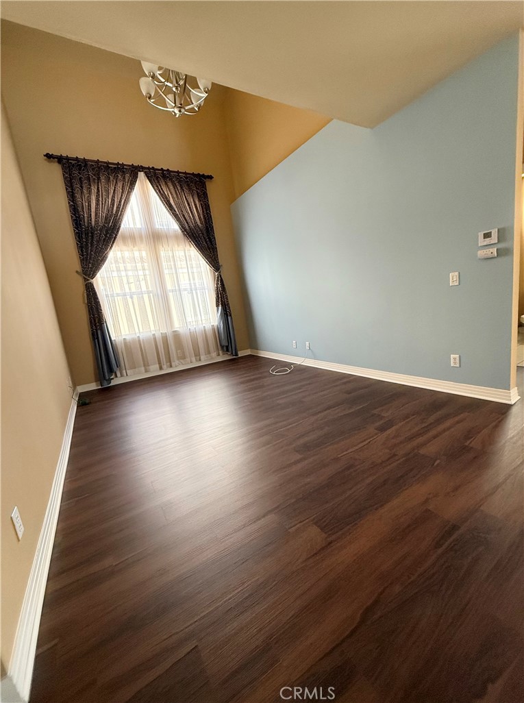 57 Alice Street, Unit A Arcadia, CA 91006 - Photo 12 of 34 an empty room with wooden floor and windows