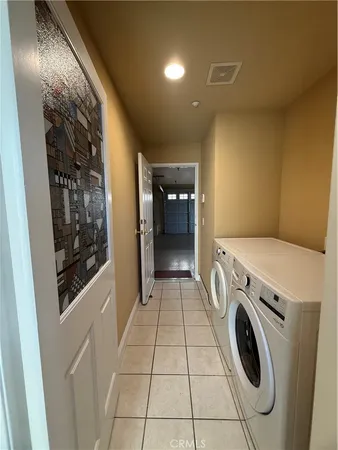 a bathroom with a granite countertop toilet and a sink