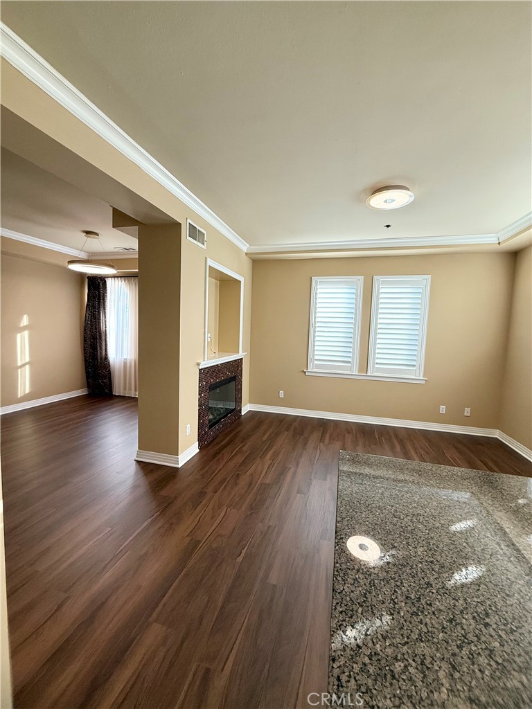 57 Alice Street, Unit A Arcadia, CA 91006 - Photo 5 of 34 an empty room with wooden floor and windows