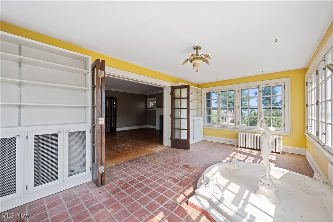 24510 Lake Road Bay Village, OH 44140 - Photo 11 of 45 Sunroom with radiator and french doors