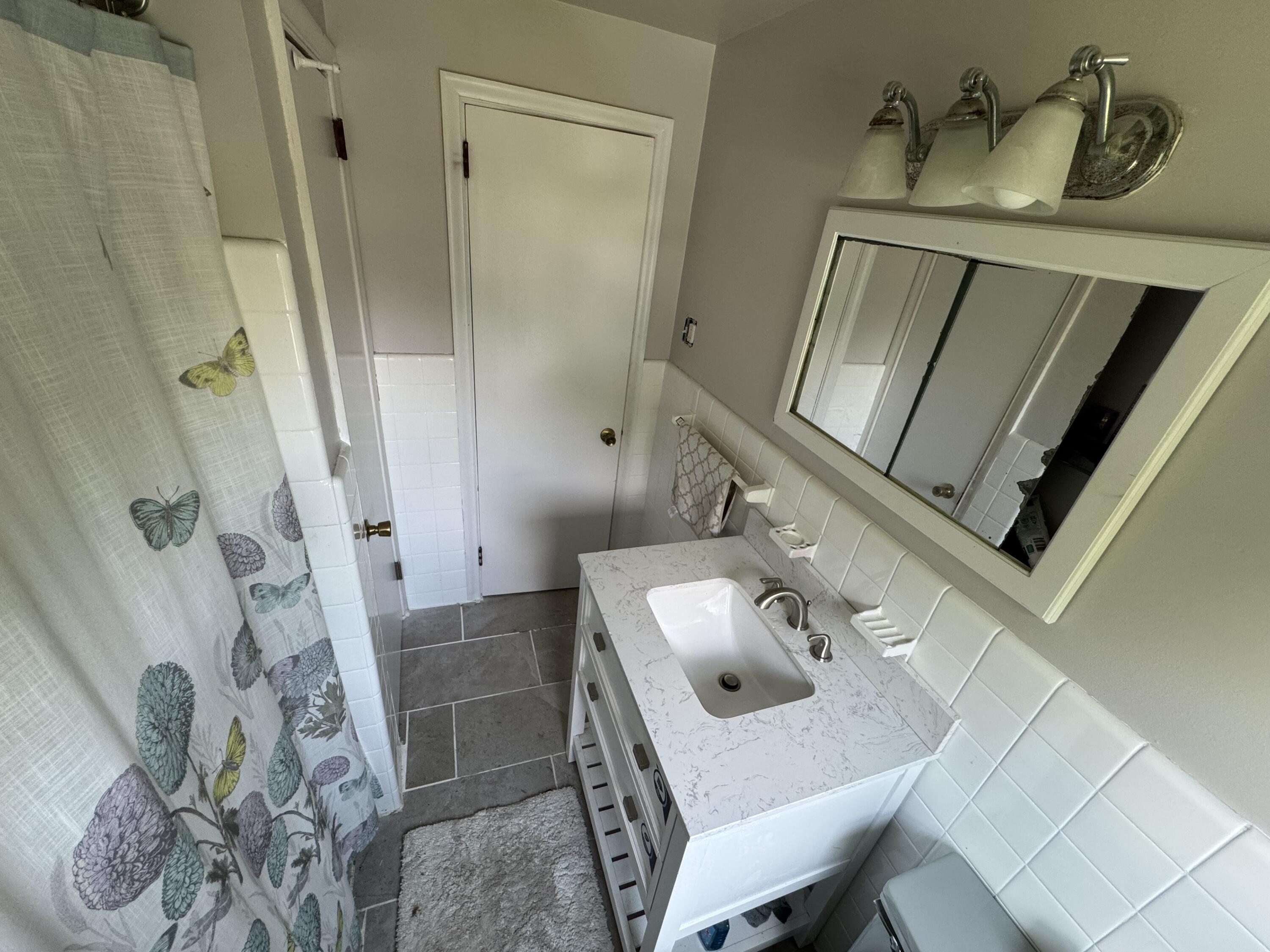 511 Grill Avenue Reading, PA 19607 - Photo 10 of 30 a bathroom with a sink a mirror and vanity