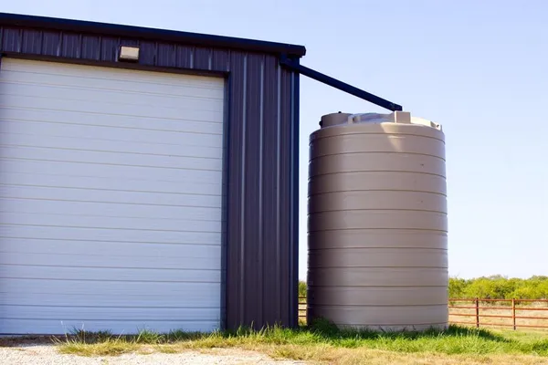 a view of swimming pool with a lounge chairs