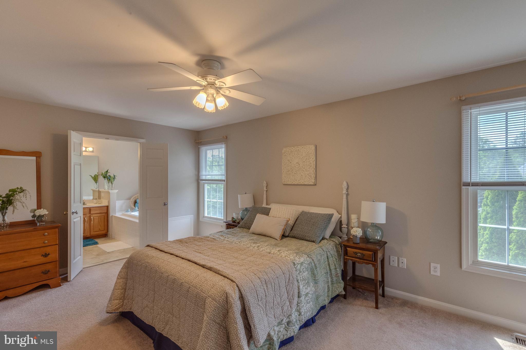 1746 Canal Run Drive Point of Rocks, MD 21777 - Photo 17 of 30 a bedroom with a large bed and a chandelier fan