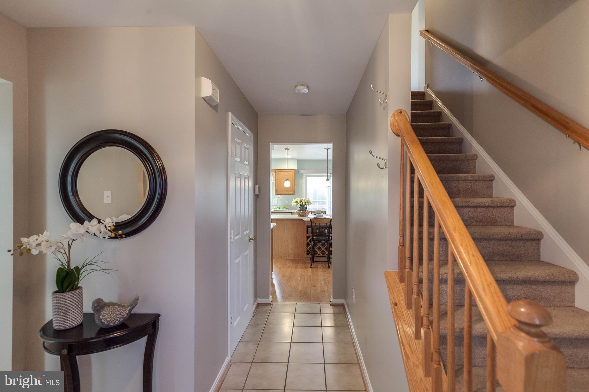 1746 Canal Run Drive Point of Rocks, MD 21777 - Photo 3 of 30 a view of a hallway with entryway wooden floor and front door