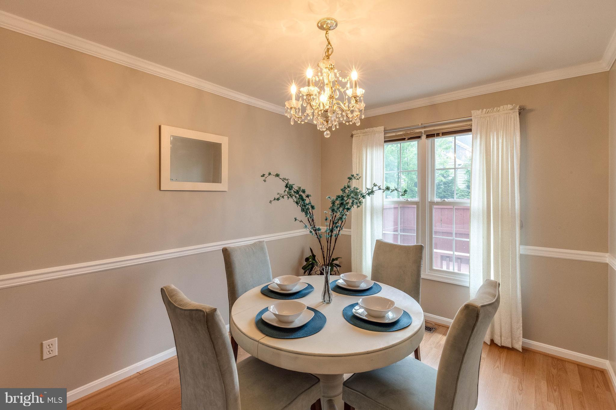 1746 Canal Run Drive Point of Rocks, MD 21777 - Photo 5 of 30 a view of a dining room with furniture a chandelier and wooden floor