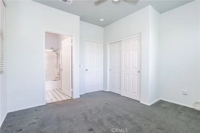 an empty room with closet area