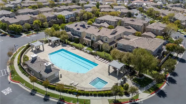 an aerial view of a house with outdoor space