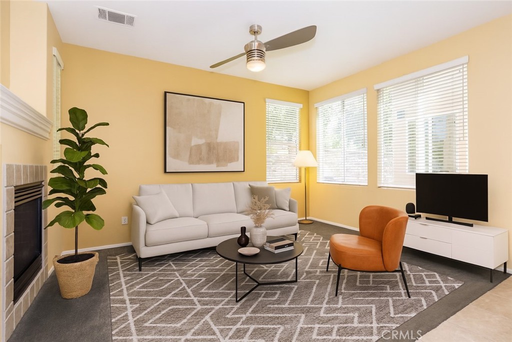 11480 Autumn Glen Court Porter Ranch, CA 91326 - Photo 6 of 38 a living room with furniture a flat screen tv and a window