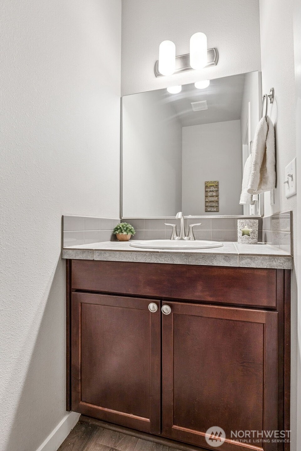 12016 264th Street East Graham, WA 98338 - Photo 15 of 40 a bathroom with a sink and a mirror