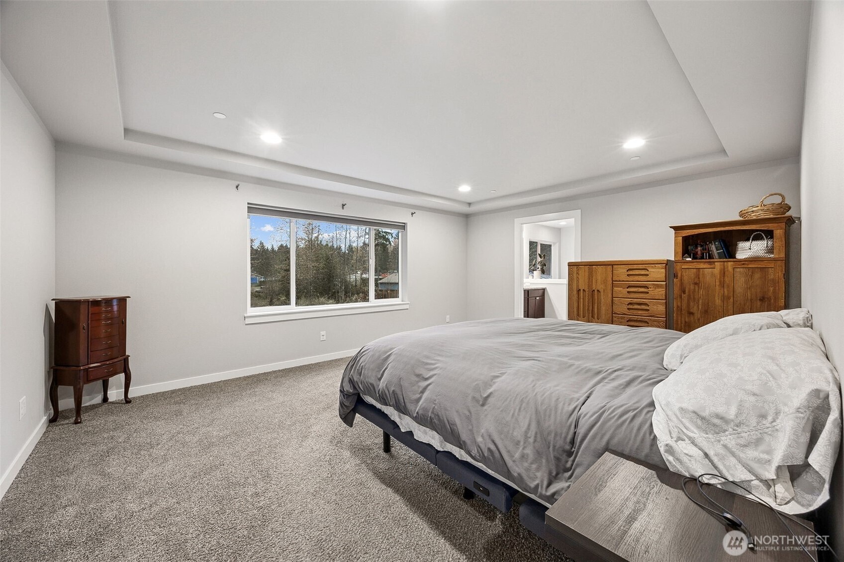 12016 264th Street East Graham, WA 98338 - Photo 18 of 40 a bedroom with a large bed and a window