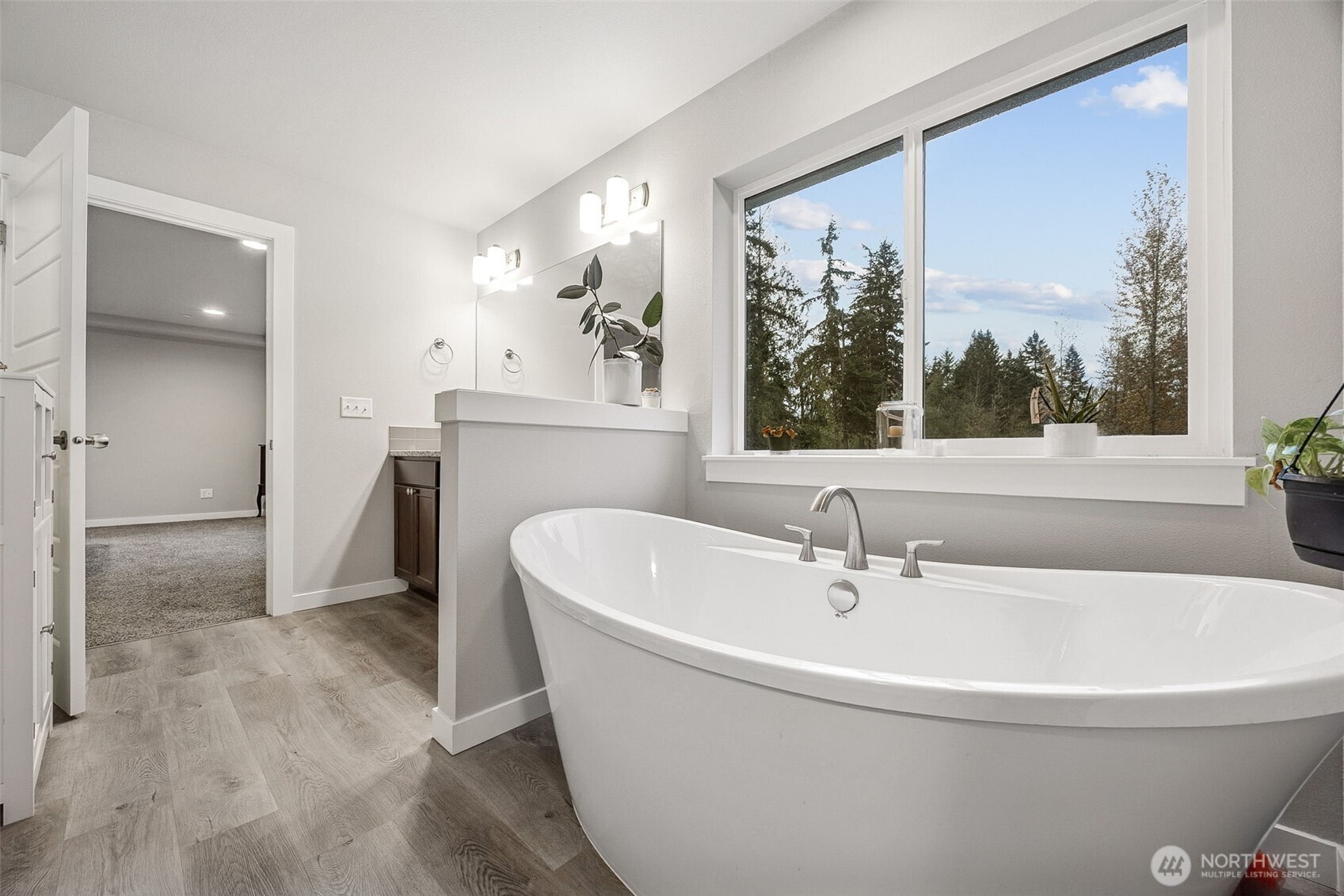 12016 264th Street East Graham, WA 98338 - Photo 21 of 40 a white bath tub sitting in a bathroom