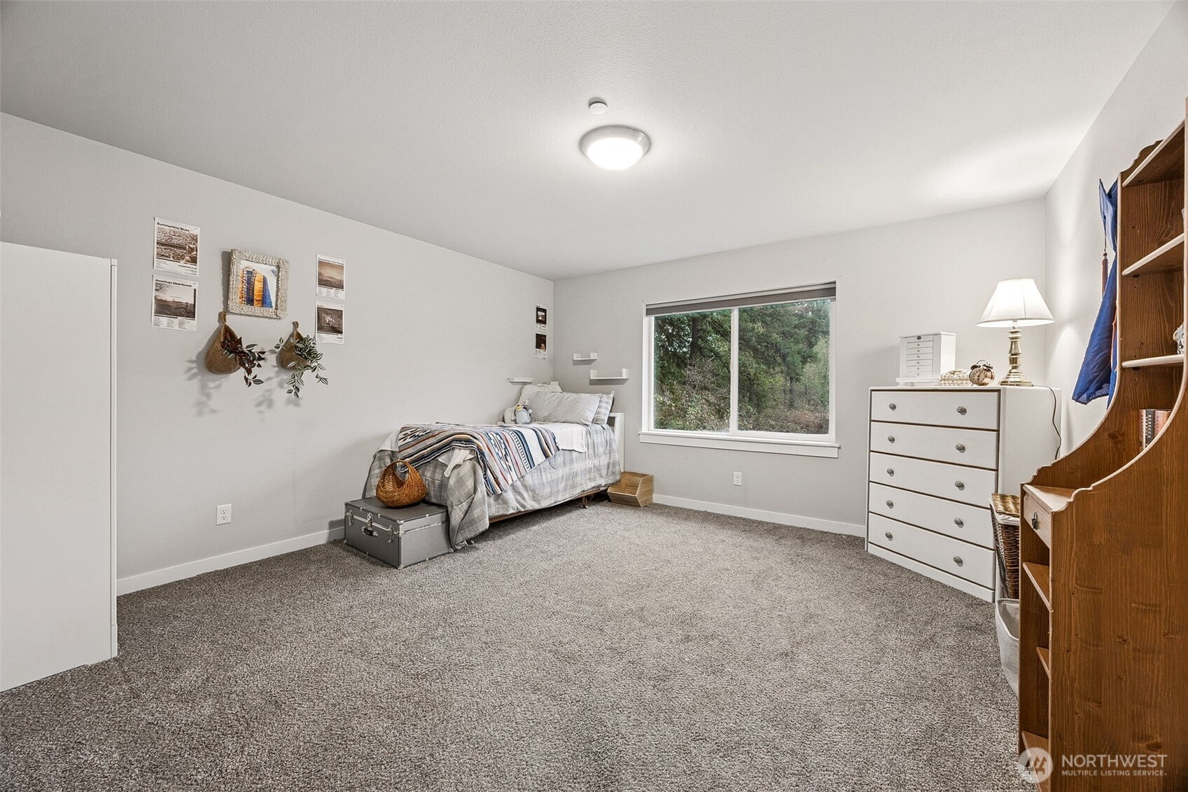 12016 264th Street East Graham, WA 98338 - Photo 22 of 40 a view of a bedroom with furniture and windows
