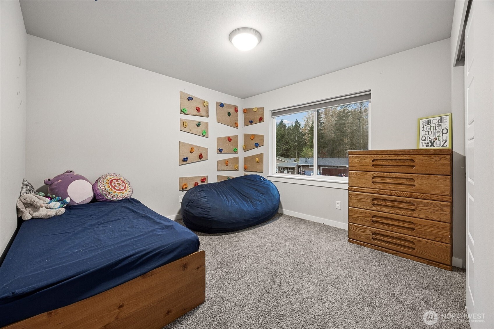 12016 264th Street East Graham, WA 98338 - Photo 27 of 40 a bedroom with furniture and a window