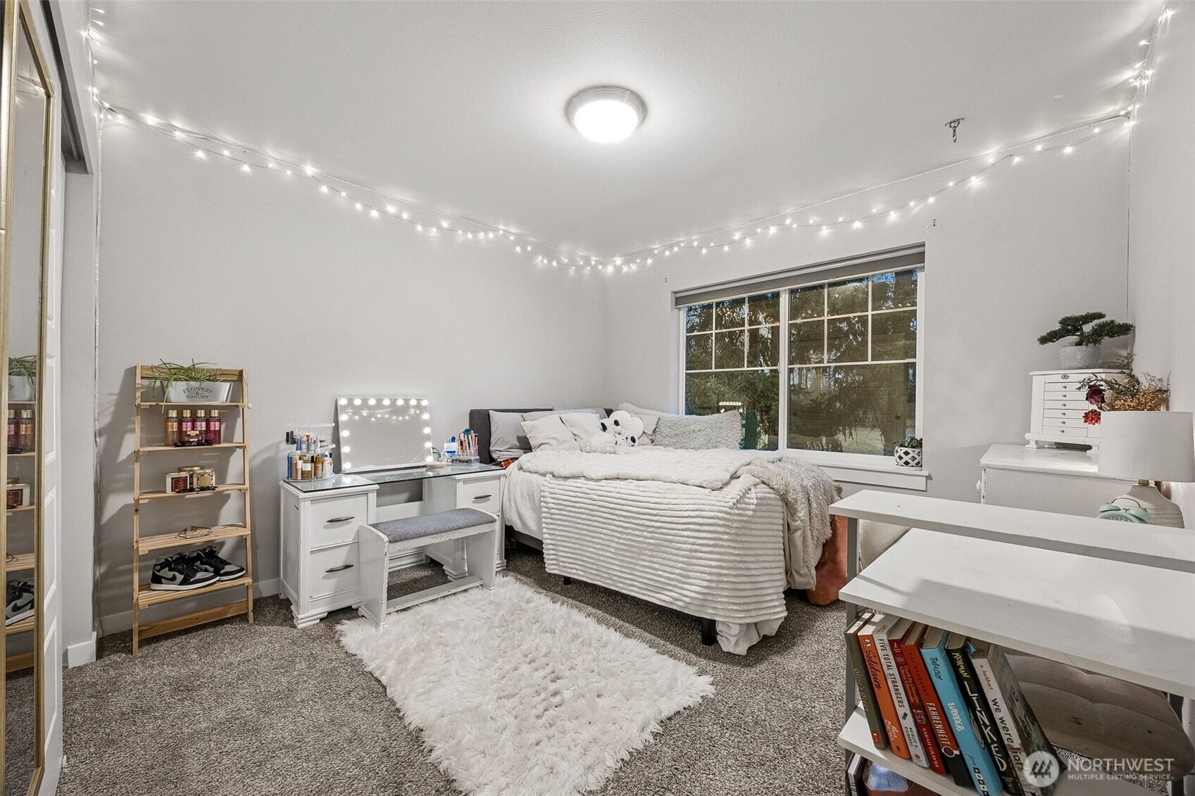 12016 264th Street East Graham, WA 98338 - Photo 28 of 40 a room with a bed and a large window