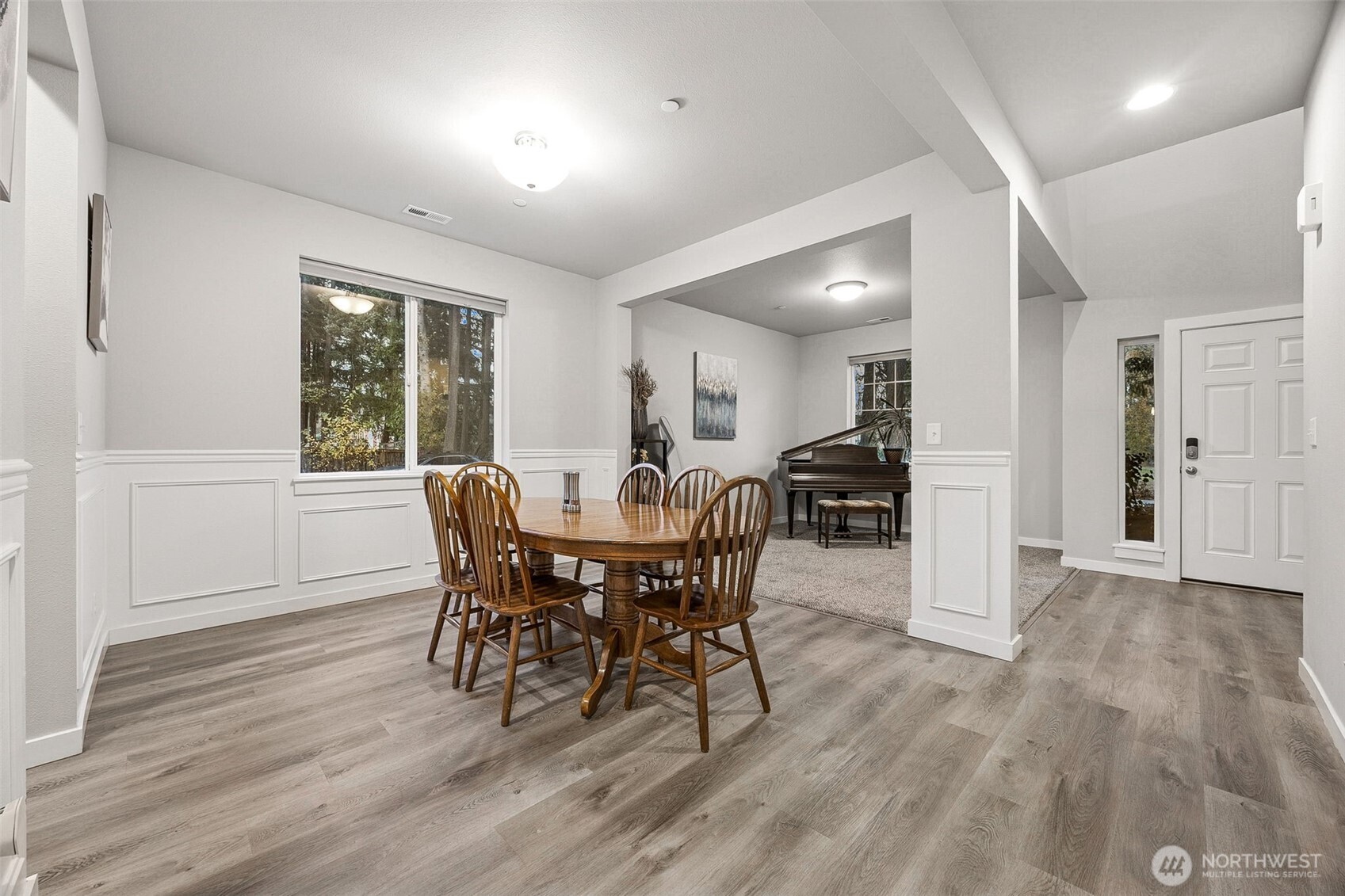12016 264th Street East Graham, WA 98338 - Photo 4 of 40 a view of a dining room with furniture and wooden floor