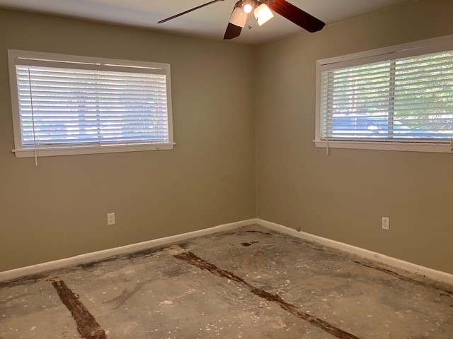 407 Wilson Road Conroe, TX 77301 - Photo 22 of 24 Third bedroom with large windows.