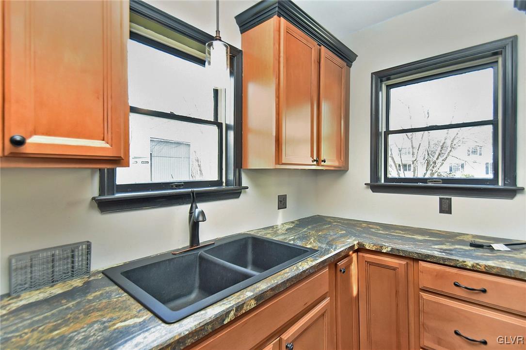 389 Meyer Road Nazareth, PA 18064 - Photo 23 of 50 a kitchen with stainless steel appliances granite countertop a sink and a window