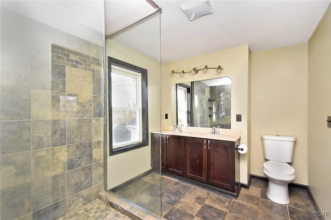 389 Meyer Road Nazareth, PA 18064 - Photo 35 of 50 a bathroom with a double vanity sink mirror and toilet