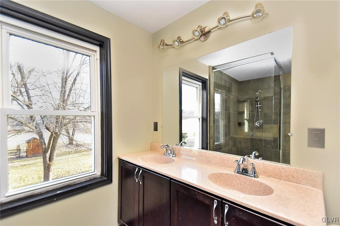 389 Meyer Road Nazareth, PA 18064 - Photo 36 of 50 a bathroom with a double vanity sink and a mirror