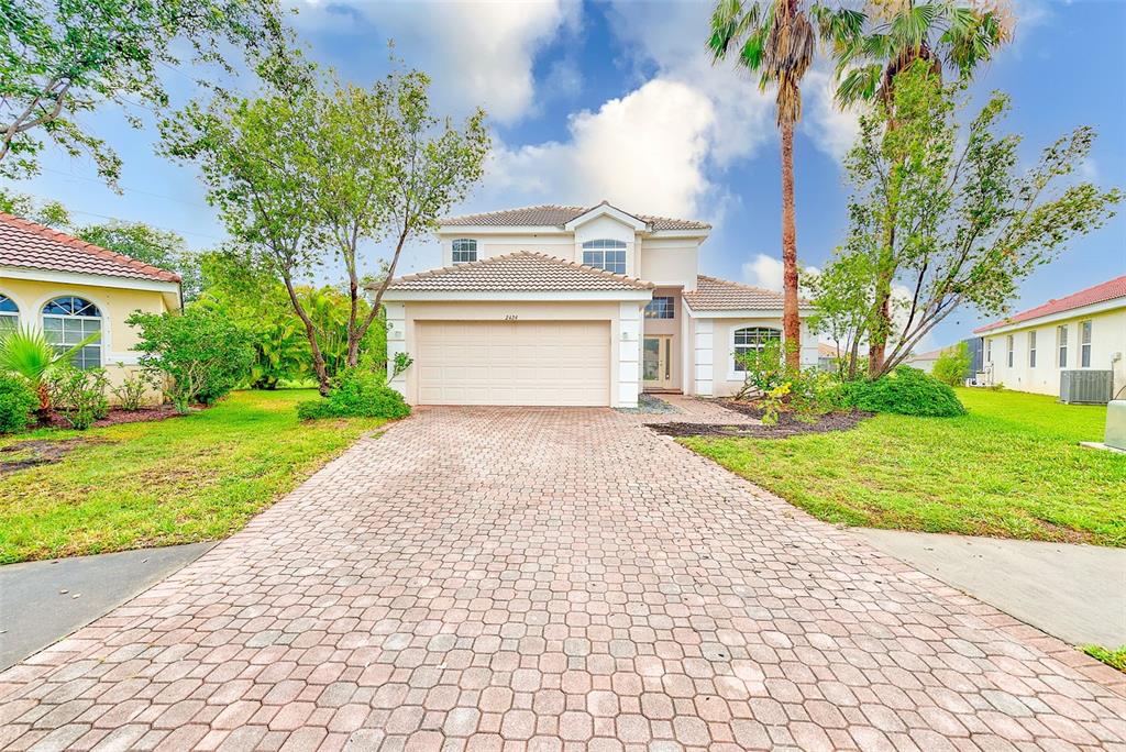2424 Caraway Drive Venice, FL 34292 - Photo 1 of 1 a front view of a house with garden