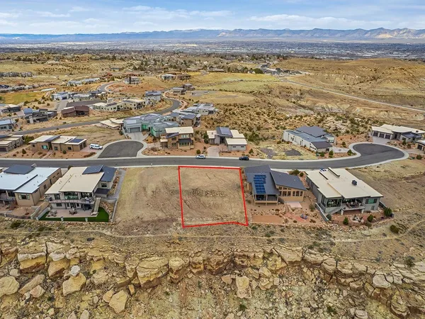 an aerial view of residential building with ocean view