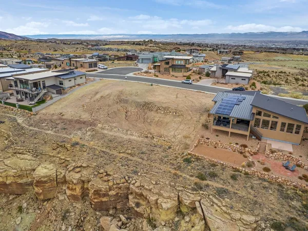an aerial view of residential building and ocean view