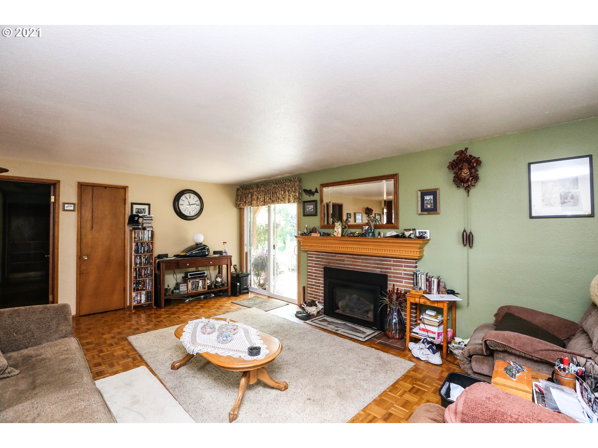 3890 Hayden Bridge Road Springfield, OR 97477 - Photo 13 of 19 a living room with furniture and a fireplace