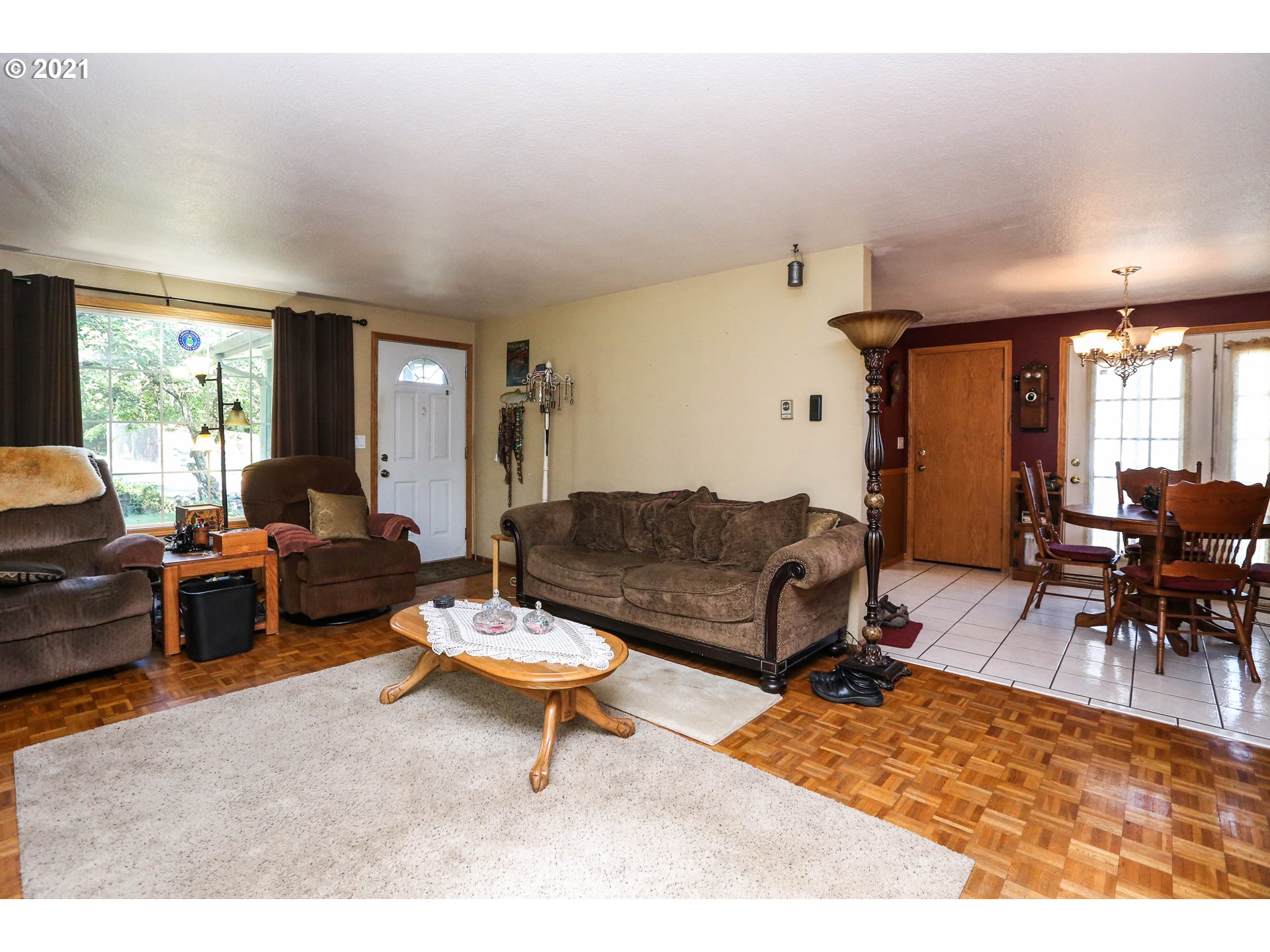 3890 Hayden Bridge Road Springfield, OR 97477 - Photo 3 of 19 a living room with furniture a rug and a table