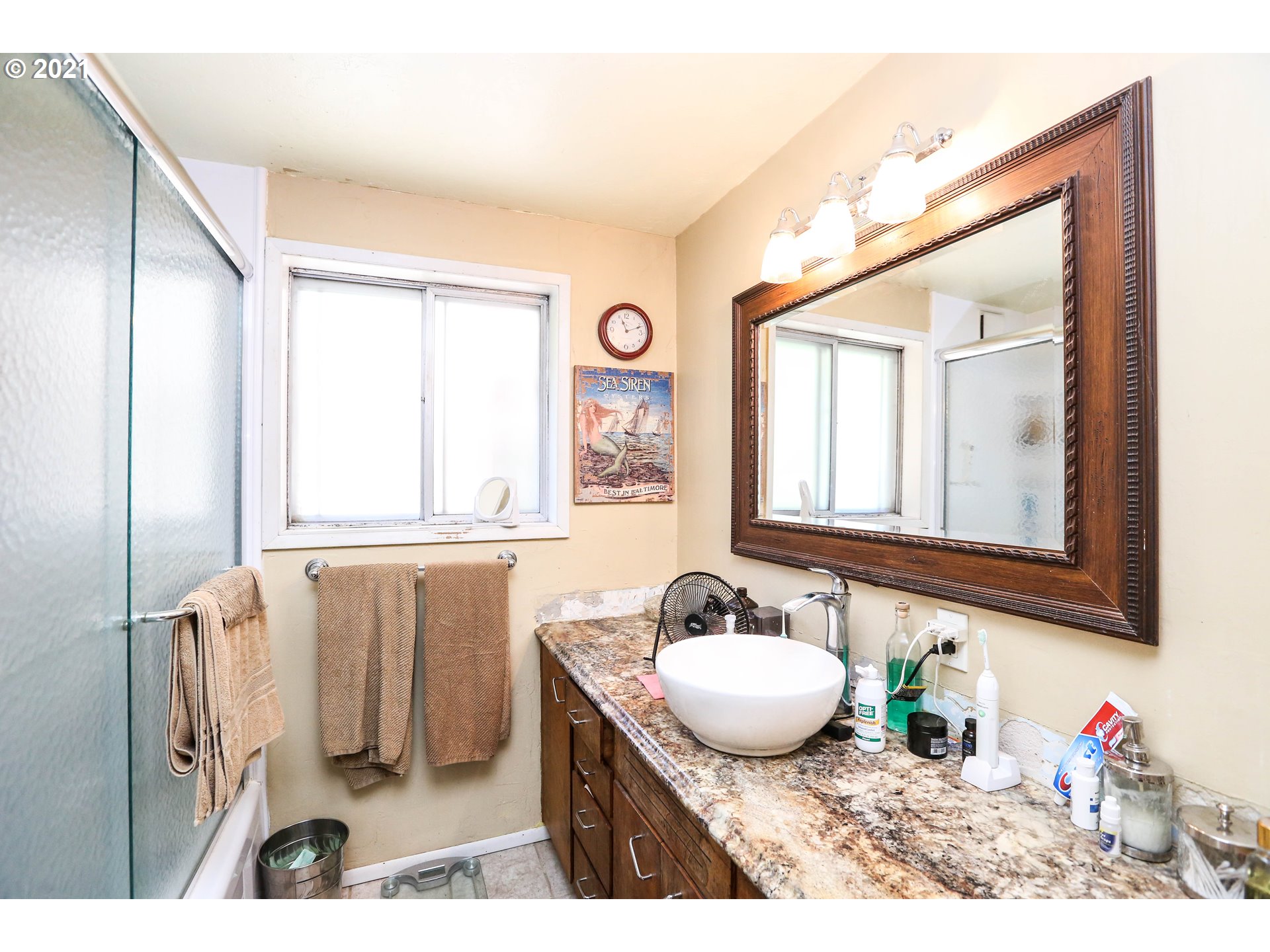 3890 Hayden Bridge Road Springfield, OR 97477 - Photo 7 of 19 a bathroom with a granite countertop sink a mirror and a window