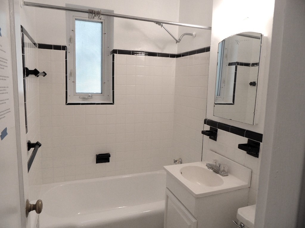 128 Beaconsfield Road, Unit 5 Brookline, MA 02445 - Photo 14 of 18 a bathroom with a sink toilet and shower