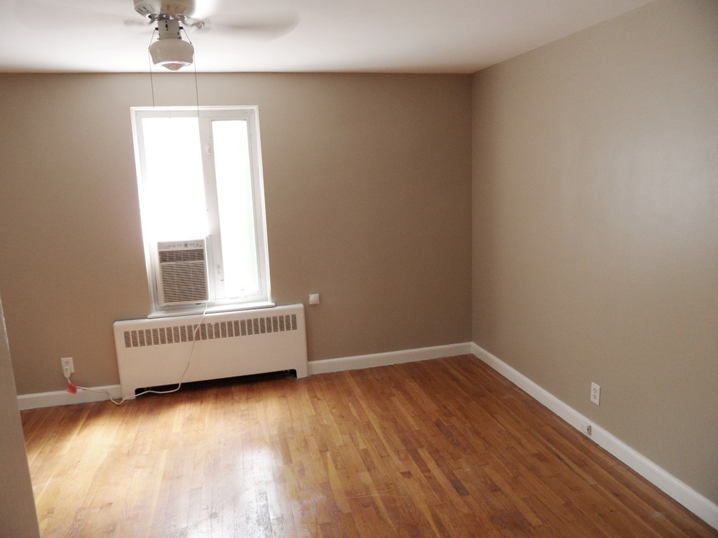 128 Beaconsfield Road, Unit 5 Brookline, MA 02445 - Photo 15 of 18 an empty room with a window