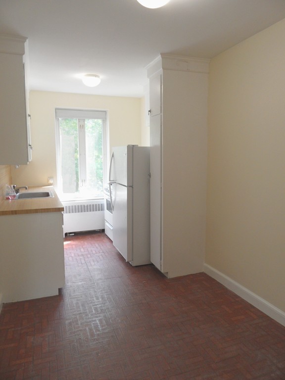 128 Beaconsfield Road, Unit 5 Brookline, MA 02445 - Photo 5 of 18 a view of a room with closet and windows