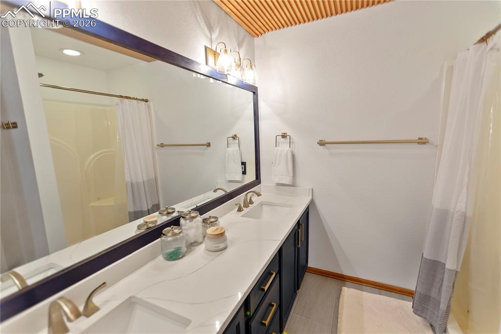 566 Spring Valley Drive Divide, CO 80814 - Photo 12 of 30 a bathroom with a sink and a mirror