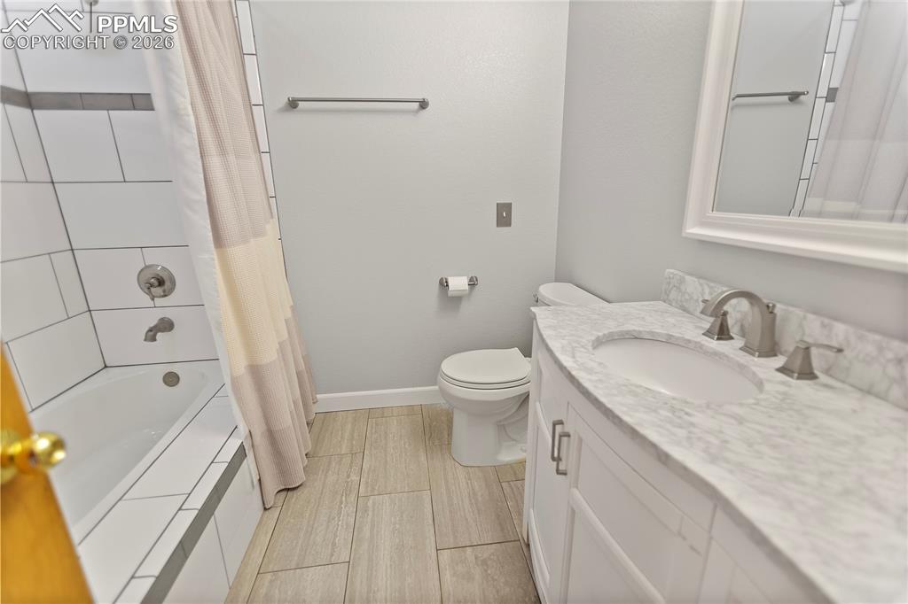 566 Spring Valley Drive Divide, CO 80814 - Photo 15 of 30 a bathroom with a sink a toilet and shower