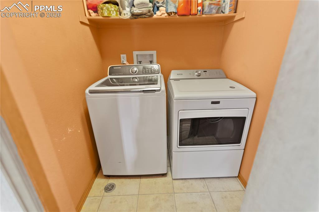 566 Spring Valley Drive Divide, CO 80814 - Photo 18 of 30 a utility room with dryer and washer