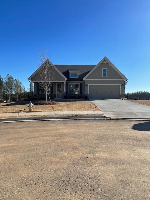 a front view of a house with yard and mountain view in front of house