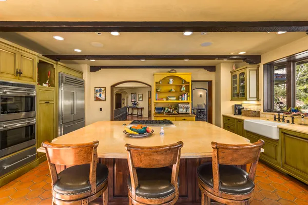 a dining room with a table and chairs