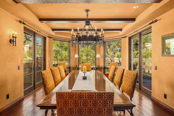 a view of a dining room with furniture window and wooden floor