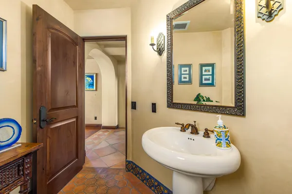 a bathroom with a sink a mirror and a shower