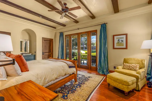 a bedroom with a large bed and a couch