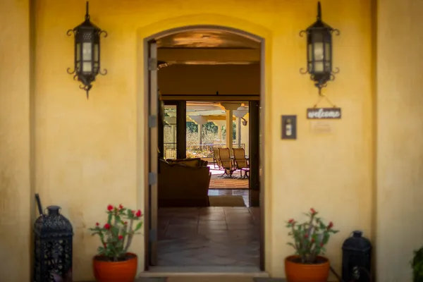 a hallway with a view of living room
