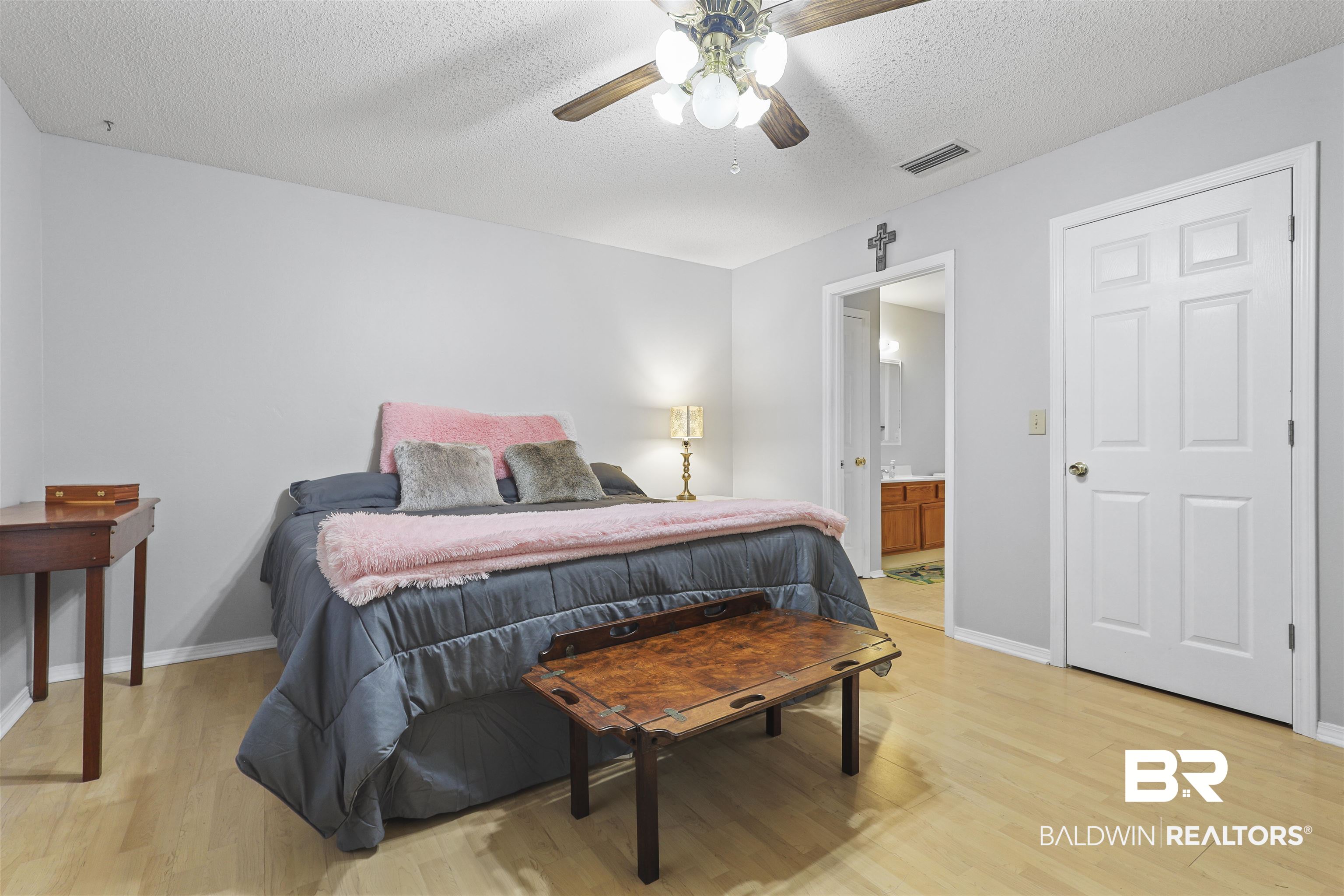507 West Amanda Avenue Foley, AL 36535 - Photo 7 of 23 Bedroom with light wood-type flooring, a textured ceiling, and ceiling fan