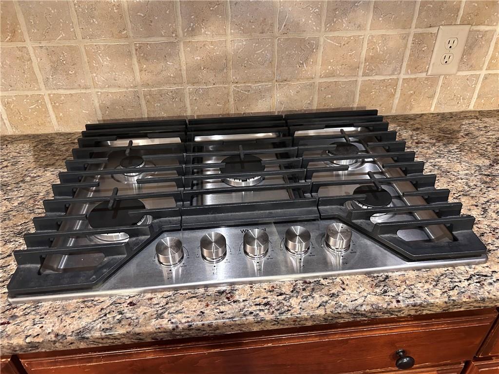 348 Hidden Trail Pendergrass, GA 30567 - Photo 18 of 40 a close view of sink a stove and kitchen countertops