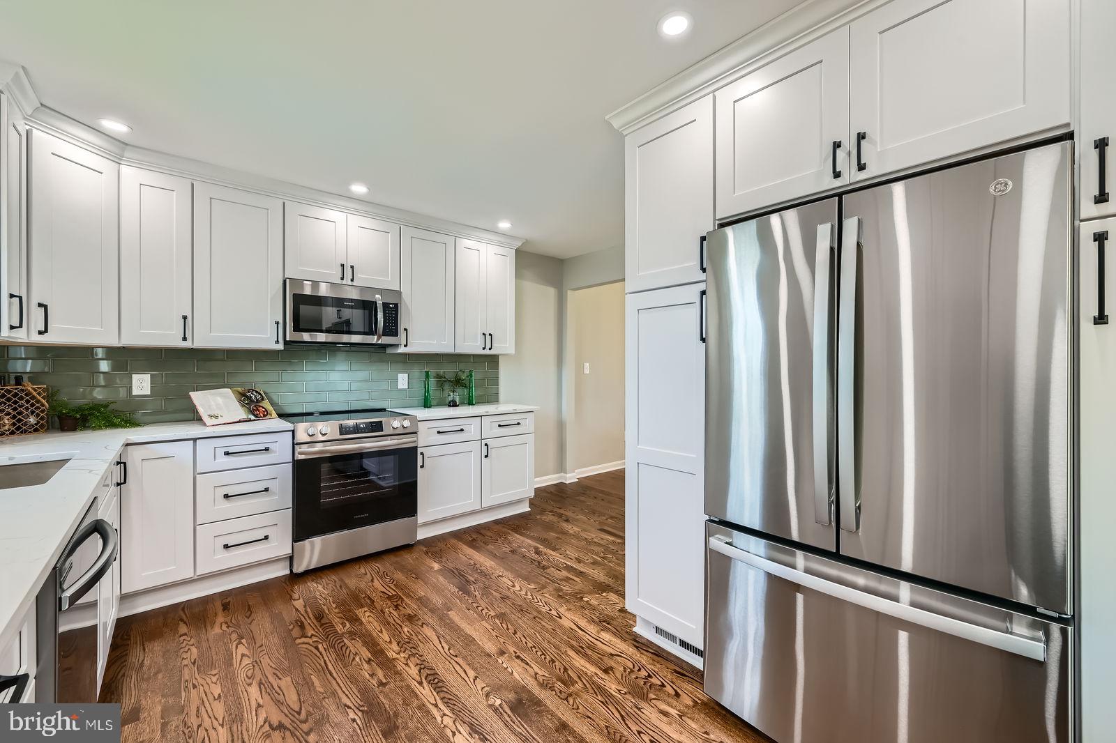 2701 Beckleysville Road Manchester, MD 21102 - Photo 11 of 39 a kitchen with stainless steel appliances a refrigerator sink and microwave