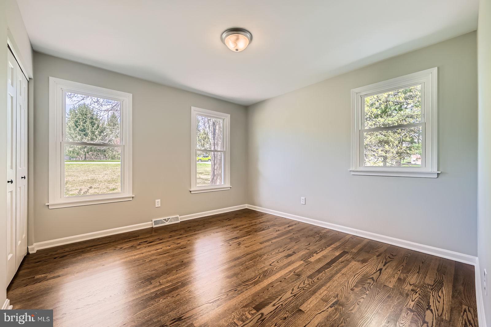 2701 Beckleysville Road Manchester, MD 21102 - Photo 19 of 39 a view of an empty room with wooden floor and a window